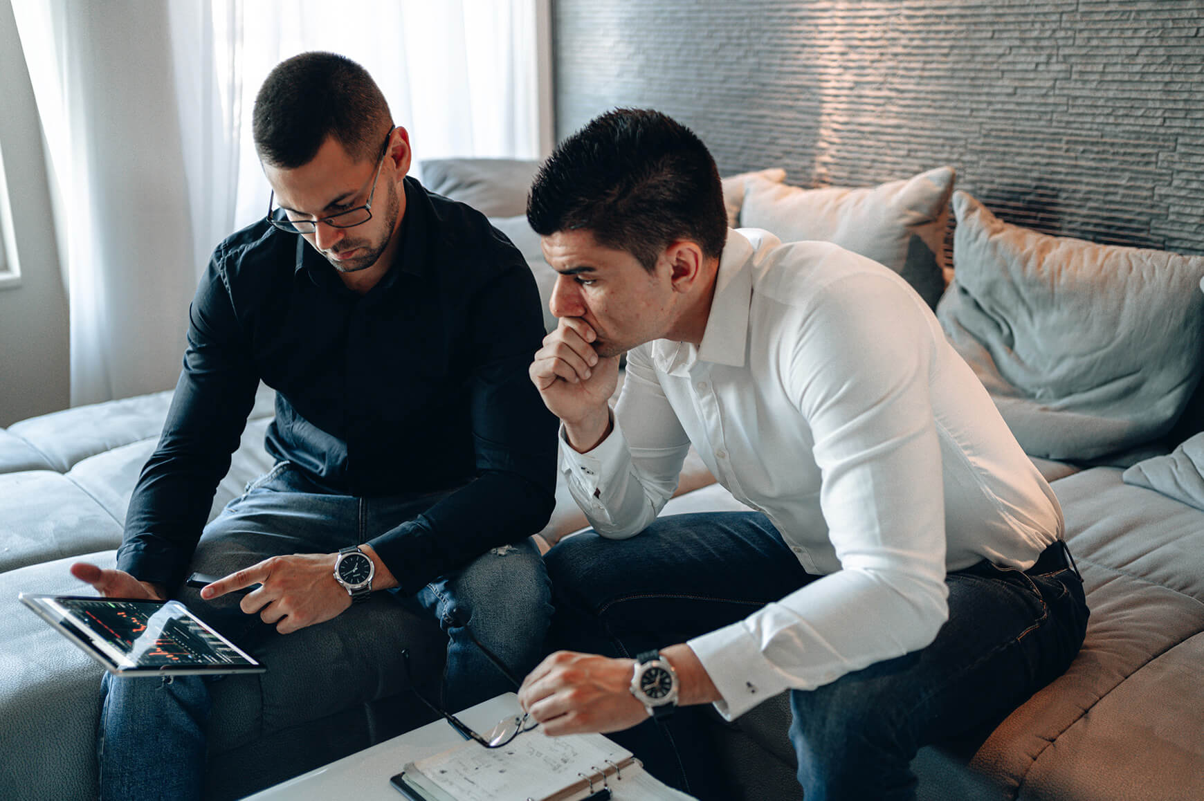 Two men analysing markets